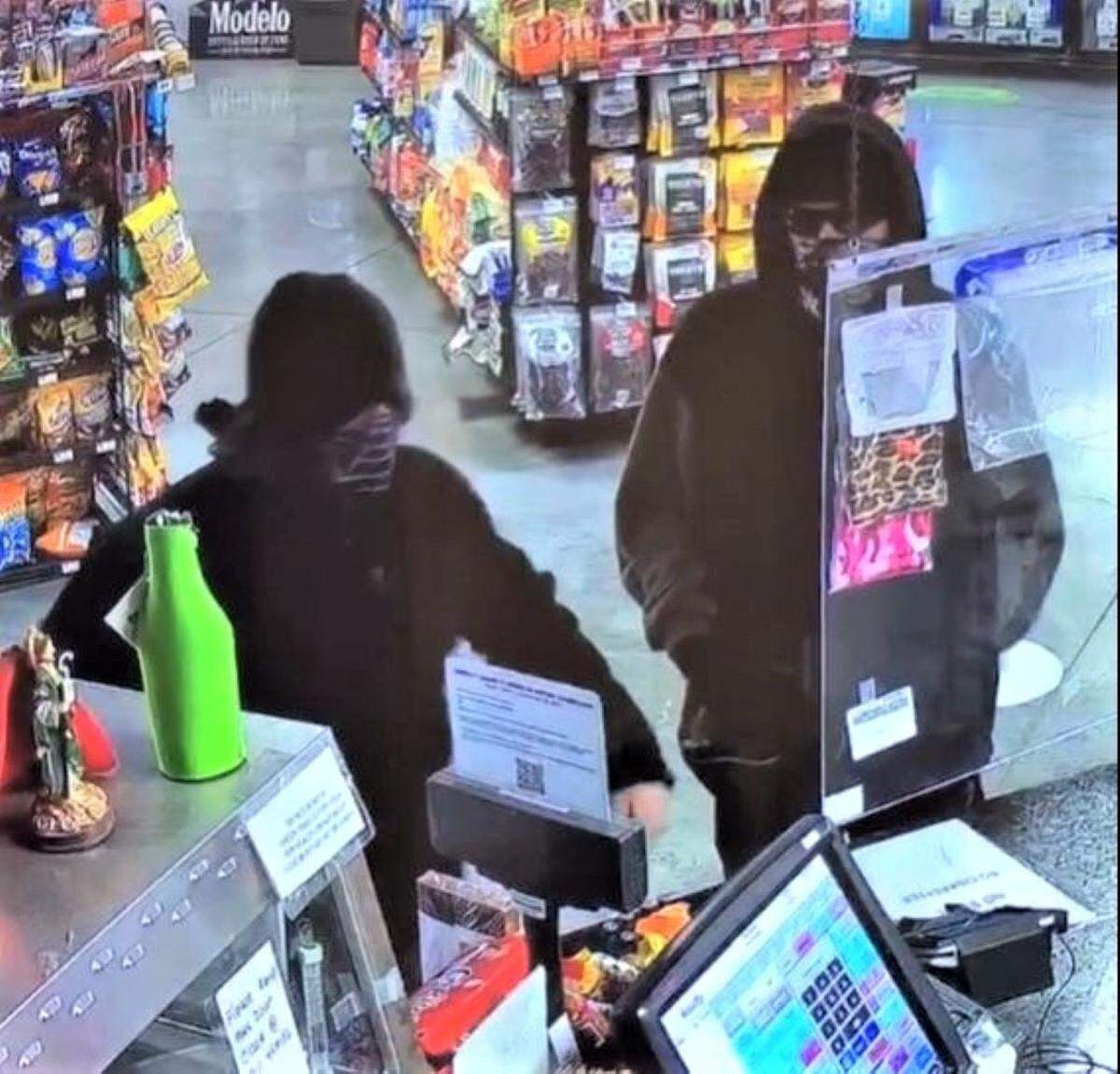 Pasco police are searching for two men who grabbed cash and cigarettes during a Monday night robbery.