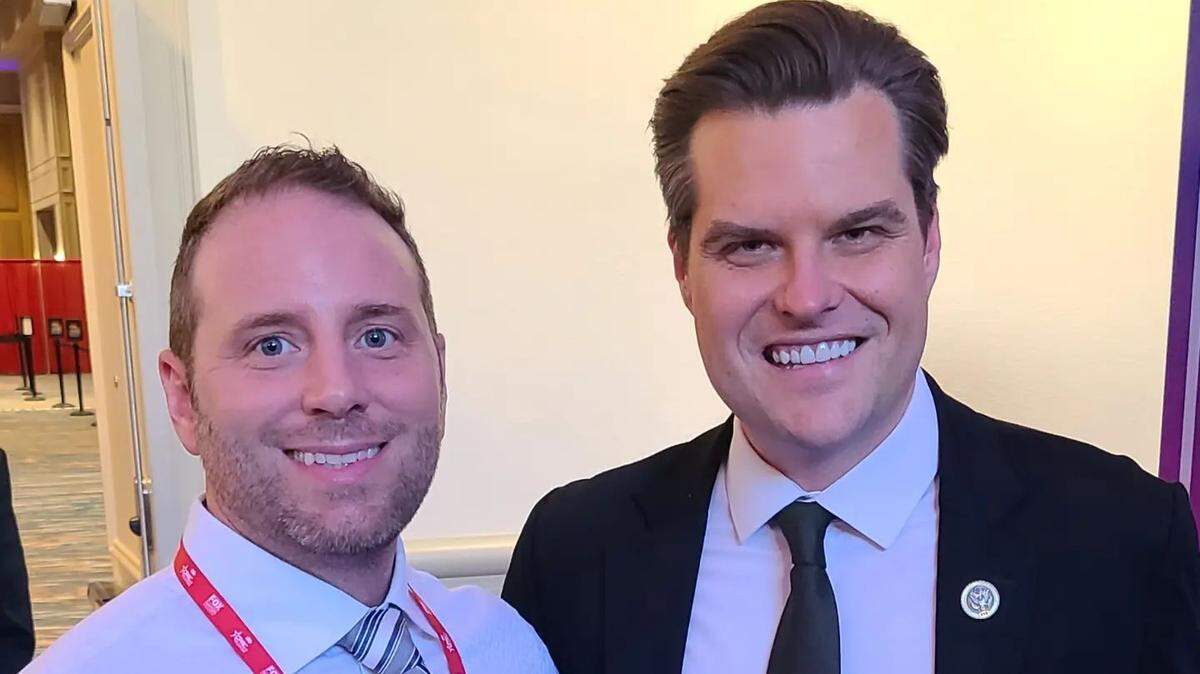 Kennewick School Board member Micah Valentine poses for a photo with Florida Congressman Matt Gaetz during the Orlando Conservation Political Action Conference, in February 2022.