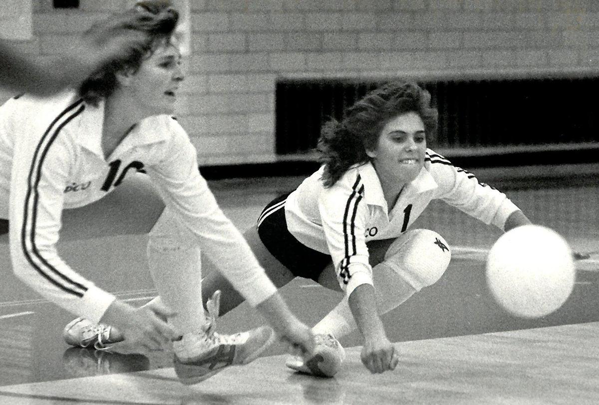 Pasco’s Joy Ebberson Curriera, left, and teammate Denise Rottinghaus dive to save the ball during a 1984 match against Eisenhower.