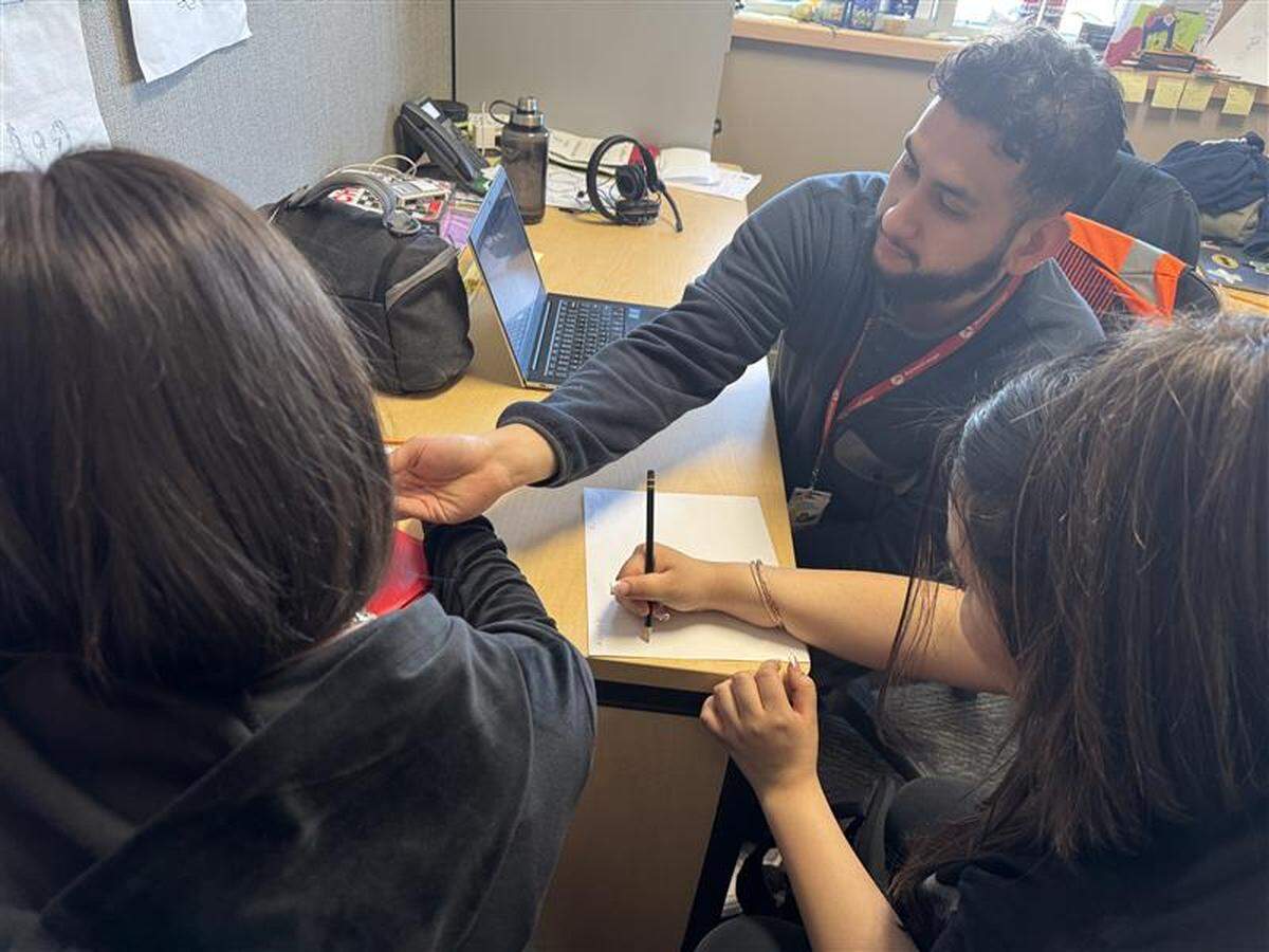 A previous mentor for the Attendance Matters program works with students at Stevens Middle School in Pasco.