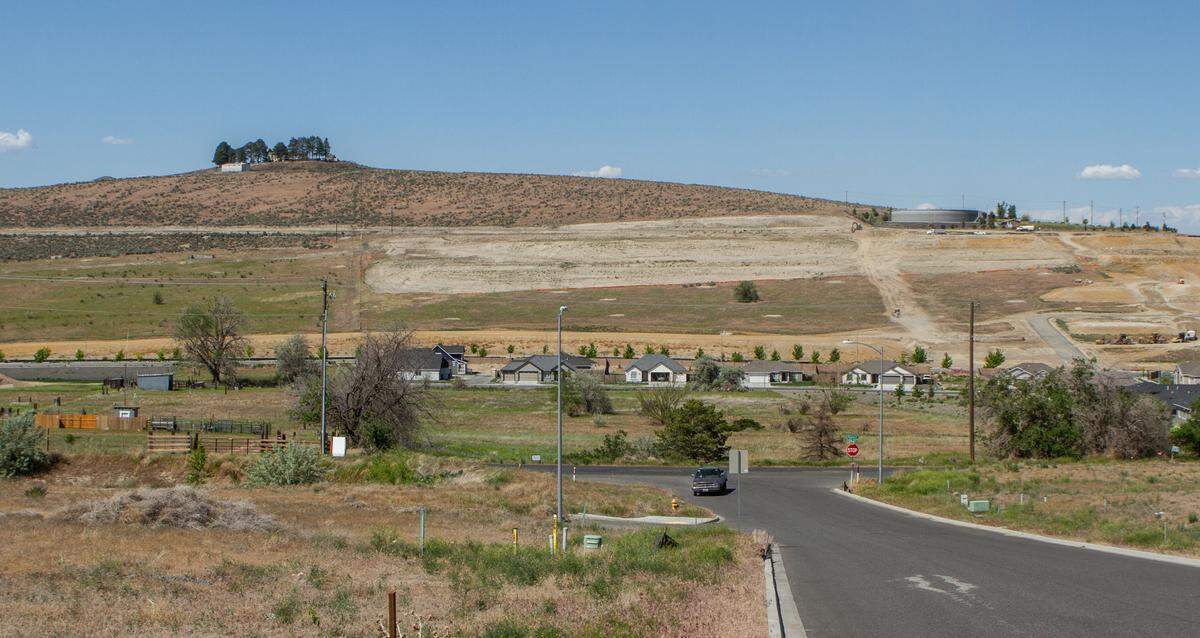 Neighbors oppose a proposal to change the Kennewick comprehensive plan to allow a hotel and restaurant on the top of Thompson Hill and medium density housing below it.