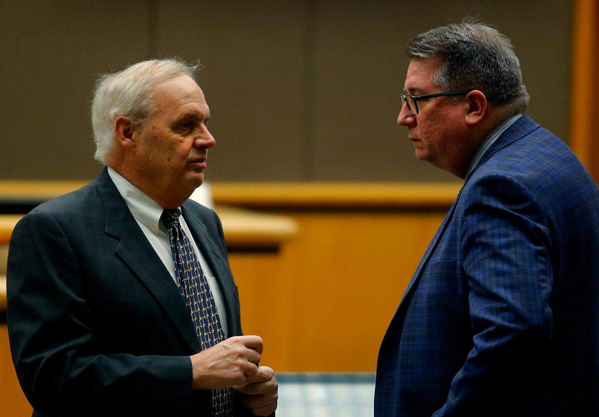 Benton County Prosecutor Andy Miller, left, and defense attorney Jeffrey Ellis confer prior to the start of Tuesday’s hearing for convicted murderer Robert Suarez in Benton County Superior Court.