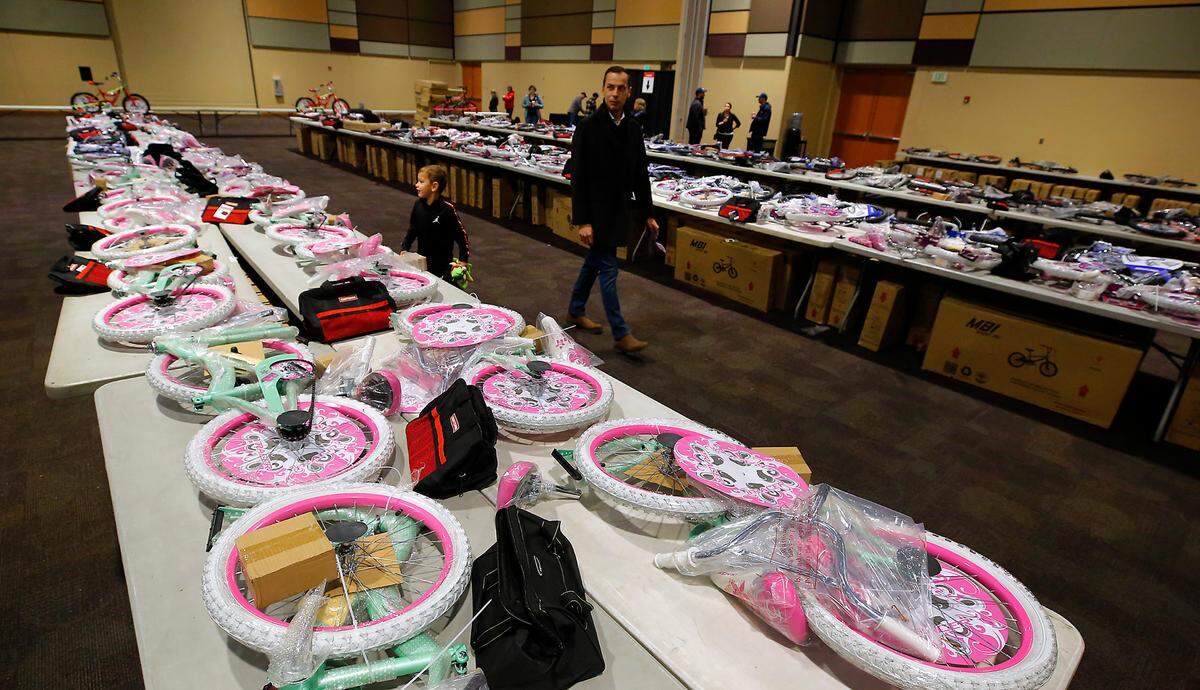 Dozens of unbuilt bicycles sit on tables prior to the start of Thursday’s 2024 Bikes for Tikes build day event.