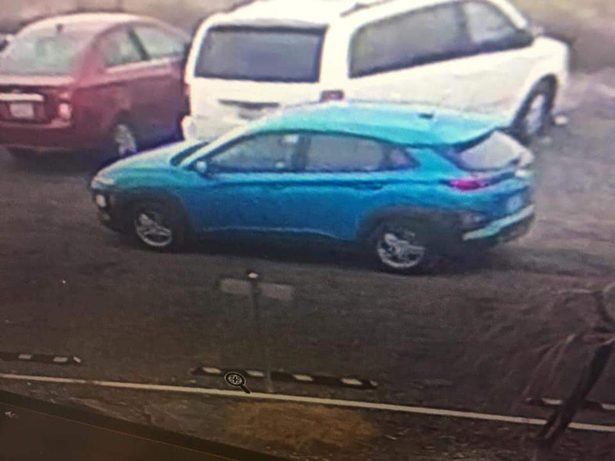 Police are looking for this blue car after a robber got into it from a stolen car.