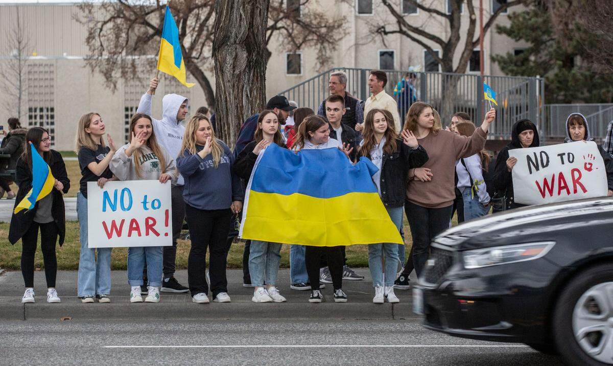 About 300 Tri-Citians gathered Tuesday evening at John Dam Plaza to show support for Ukraine and denounce the Russian-instigated war. 