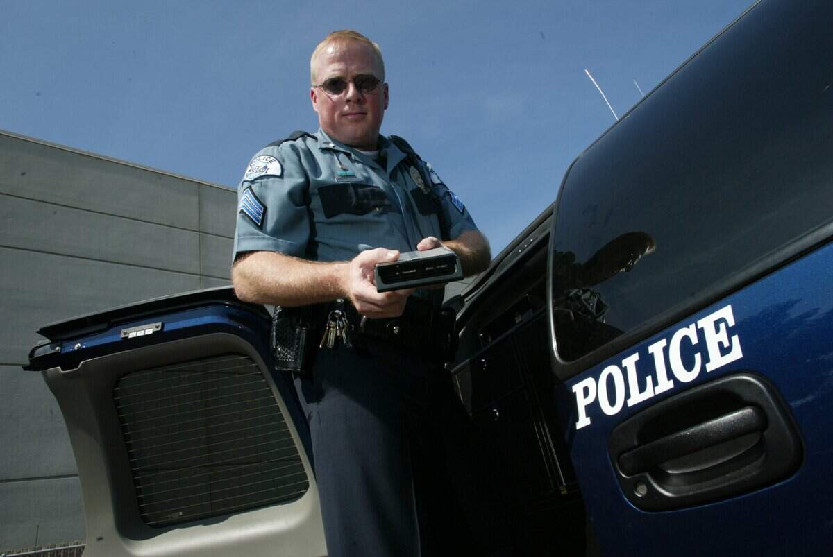 Shown here in 2003, Ken Roske holds a new digital video system installed on all 17 police vehicles. Roske was recently picked to lead the department.
