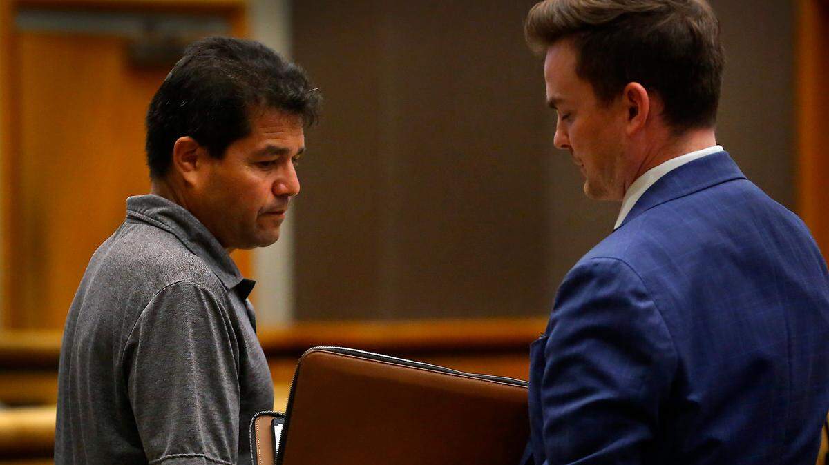 The Rev. Tomás Vázquez Téllez, left, talks with defense attorney Deric Orr during a hearing in Benton County Superior Court in Kennewick.