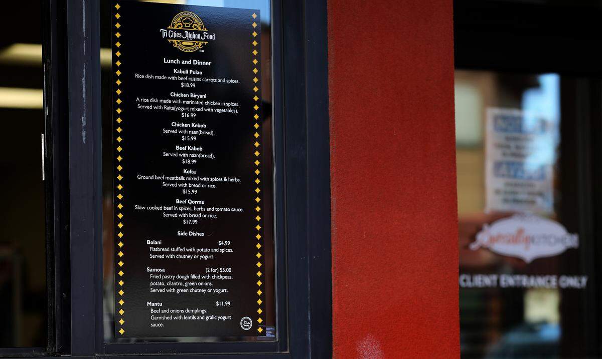 Tri-Cities Afghan Food menu posted on order window at the Pasco Specialty Kitchen, the commercial kitchen incubator in downtown.