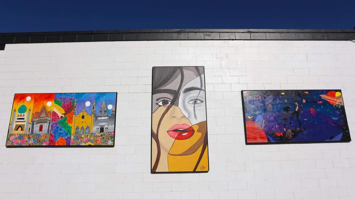 Three high school students created murals for the wall at Moon Security in downtown Pasco. The murals, from left, are by Aleah Mahaffey, Ella Lehrman and Zahara Acevedo.