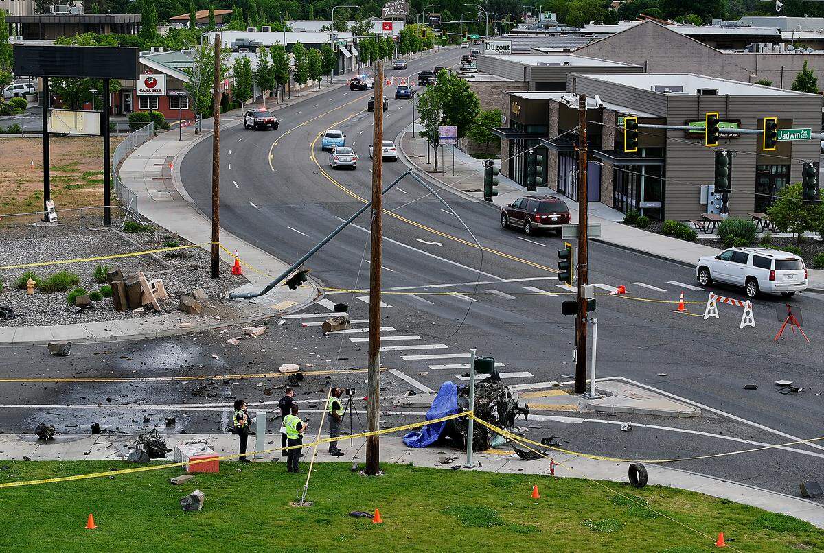 The car was destroyed when it crashed into a metal streetlight at the corner of Jadwin Avenue, knocking it over, and hitting a decorative basalt column sign. 