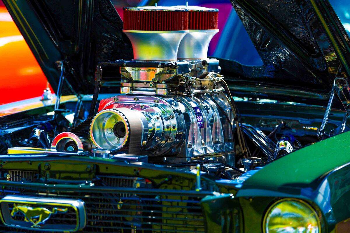 The polished engine of a restored classic car is displayed Saturday during the Show N Shine at Cool Desert Nights in Richland. Hundreds of classic vehicles filled the Uptown Shopping Center during the annual community event.