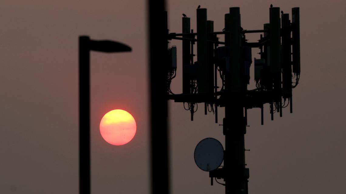 The sky glows in brilliant hues as the sun rises over the Tri-Cities on a hazy late summer morning.