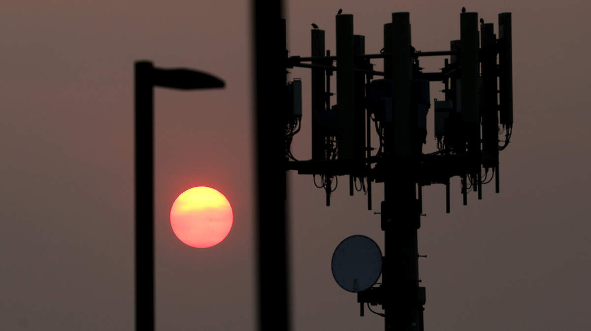 The sky glows in brilliant hues as the sun rises over the Tri-Cities on a hazy late summer morning.