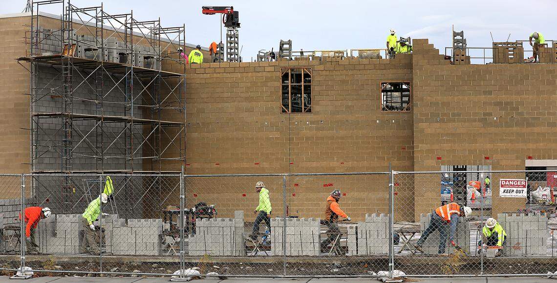 Masonry crews work on constructing block walls for the expansion project at the Three Rivers Convention Center in Kennewick.