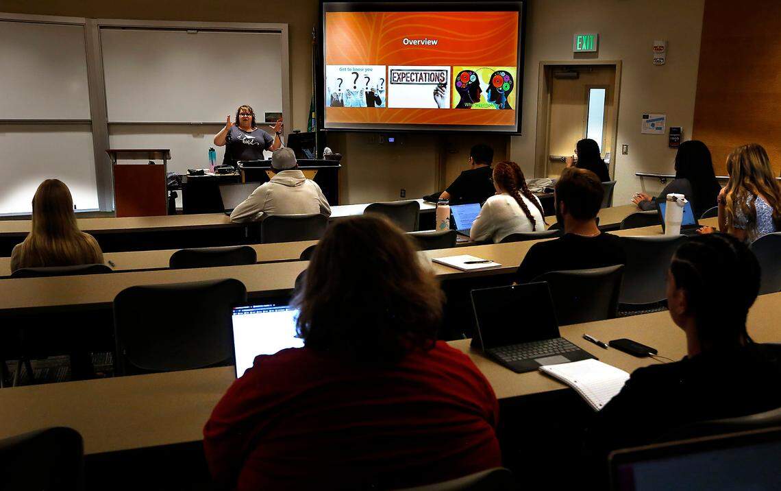Instructor Jen Munson goes over expectations for her general psychology course with her students gathered in the lecture hall of the Social Sciences and World Languages building in the Pasco for the first day of fall classes of the new academic school year. College officials say their first day numbers show a 6.4% increase over last year, with a total of 5960 students enrolled.