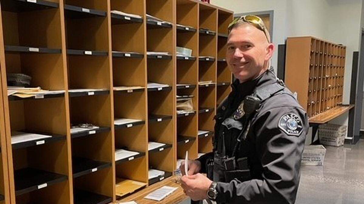 A Pasco police officer is back at work after being shot in December.