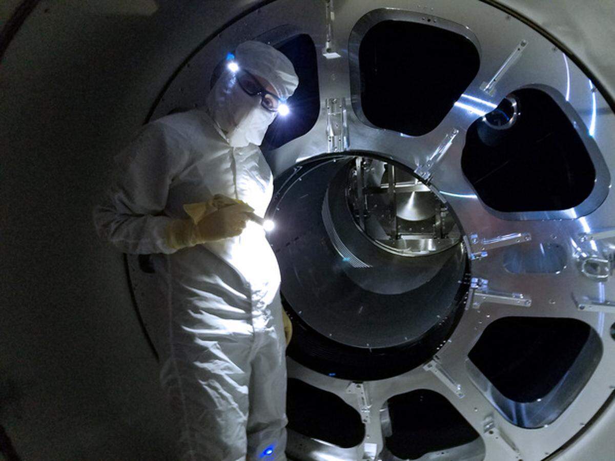 LIGO team member Alena Ananyeva iworks to install new baffles at the LIGO Livington Observatory as part of the LIGO instrument that controls stray lights.