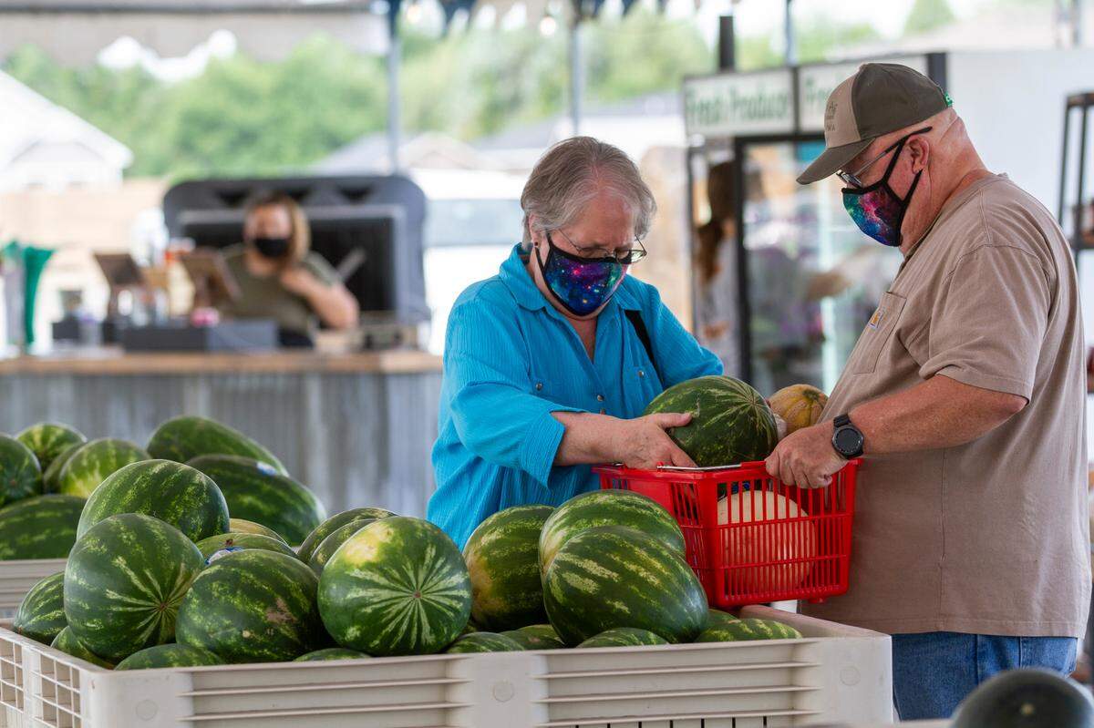 Pat and Mike Aldridge of Pasco pick out a watermelon at In Season Produce off of West Court Street in Pasco.
