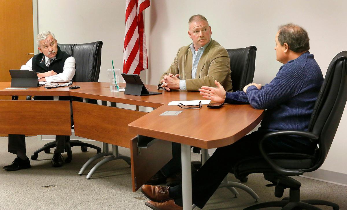 Benton County Commissioners, Jim Beaver, Shon Small and Jerome Delvin, from left, talk at a recent special meeting about the jail takeover.