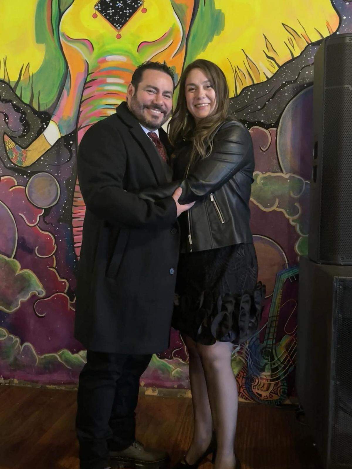 Christian Iturriaga, 49, and Teresa Iturriaga, 45, on their wedding day at The Emerald of Siam, Feb. 8. The Richland restaurant and venue’s iconic elephant mural can be seen behind the couple.