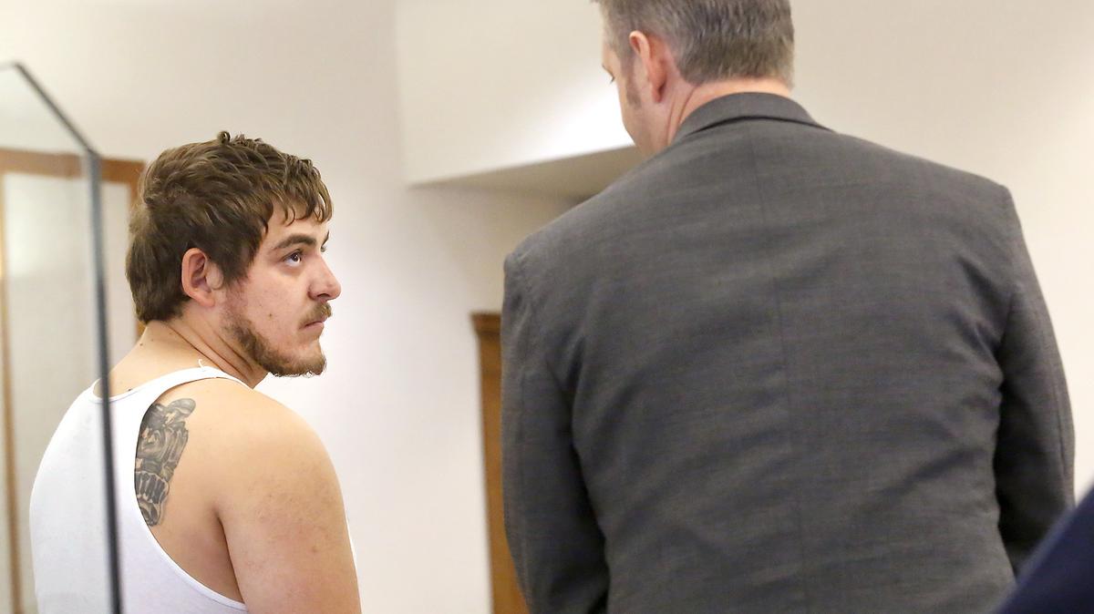 Shooting suspect Jose Valdez, 24, of Pasco appears in Franklin County Superior Court in Pasco. He is facing three counts of first-degree assault after allegedly shooting at three people outside a Pasco car dealership on July 22. He stands with public defender Michael Quillen.