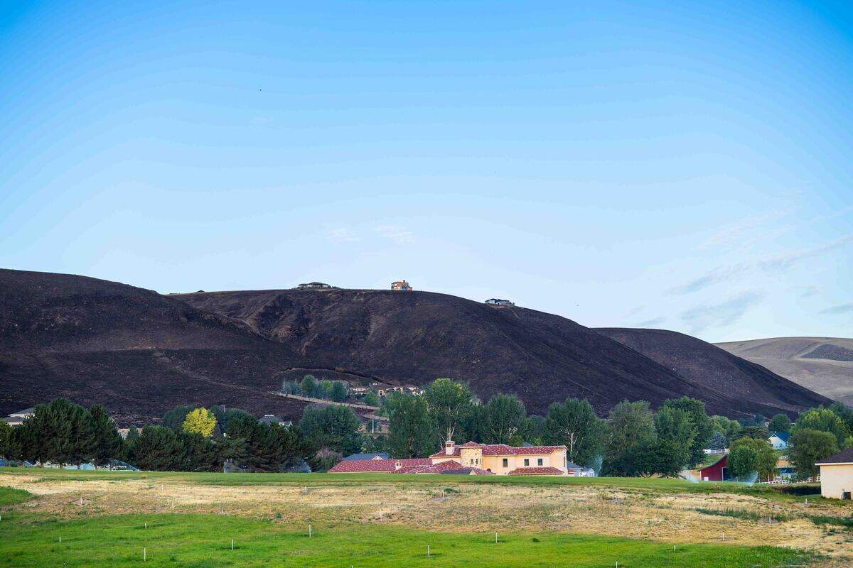 Wildfires threatened homes in the Badger Canyon area on July 4.
