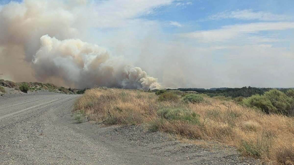 A wildfire in Walla Walla County grew to more than 13,000 acres Monday, including 1,000 acres of the Wallula Unit at McNary National Wildlife Refuge.