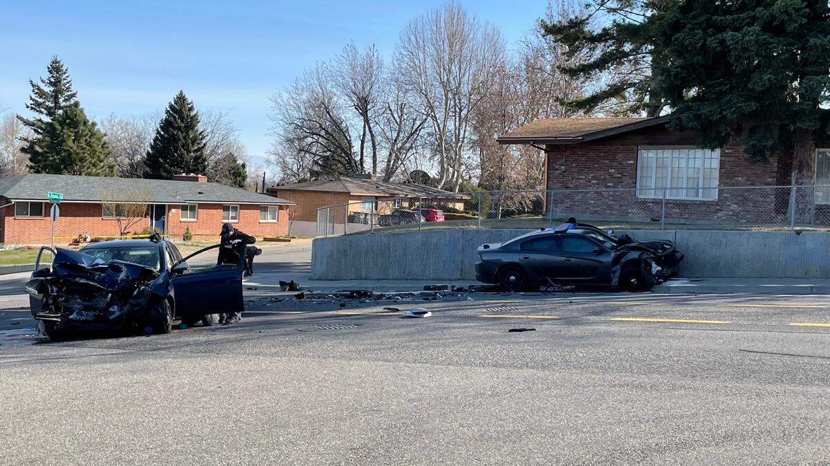 A woman passenger died in an early Sunday crash in Kennewick with a Benton County sheriff’s car, right, said officials.