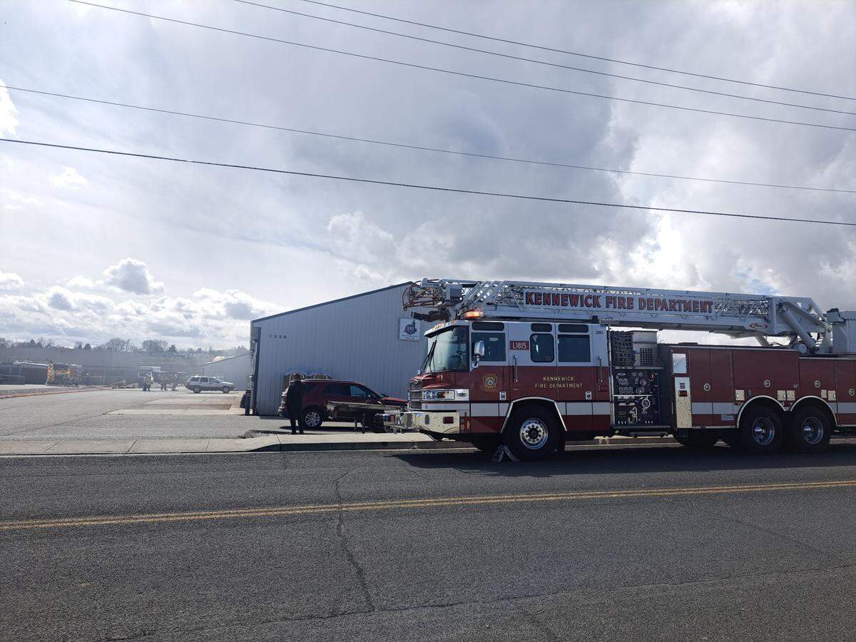Firefighters battled a commercial blaze that threatened businesses in the 1300 block of E. 3rd Ave. in Kennewick on Tuesday.
