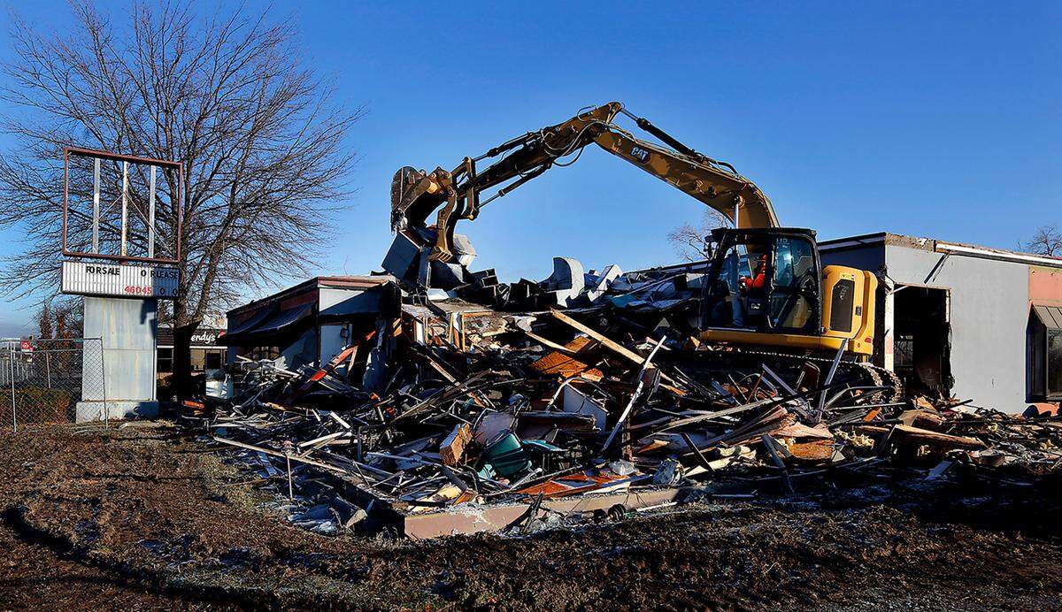 An excavator from TC Excavation of Hermiston, Ore., began demolishing a former restaurant building in Richland in January 2023 for a Panda Express and a second restaurant.
