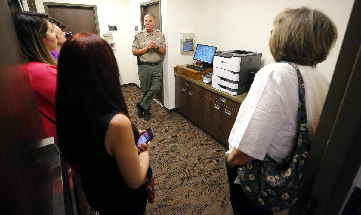 Franklin County Sheriff Jim Raymond answers questions about their fingerprint stations after holding a news conference Monday at the sheriff's office in Pasco.