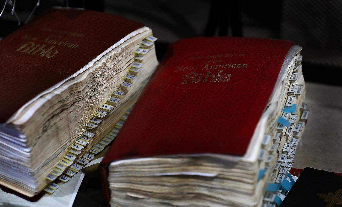 A pair of well-used Bibles belonging to Lillian and Ernesto Parra were among the very few personal items recovered from their fire-damaged home.