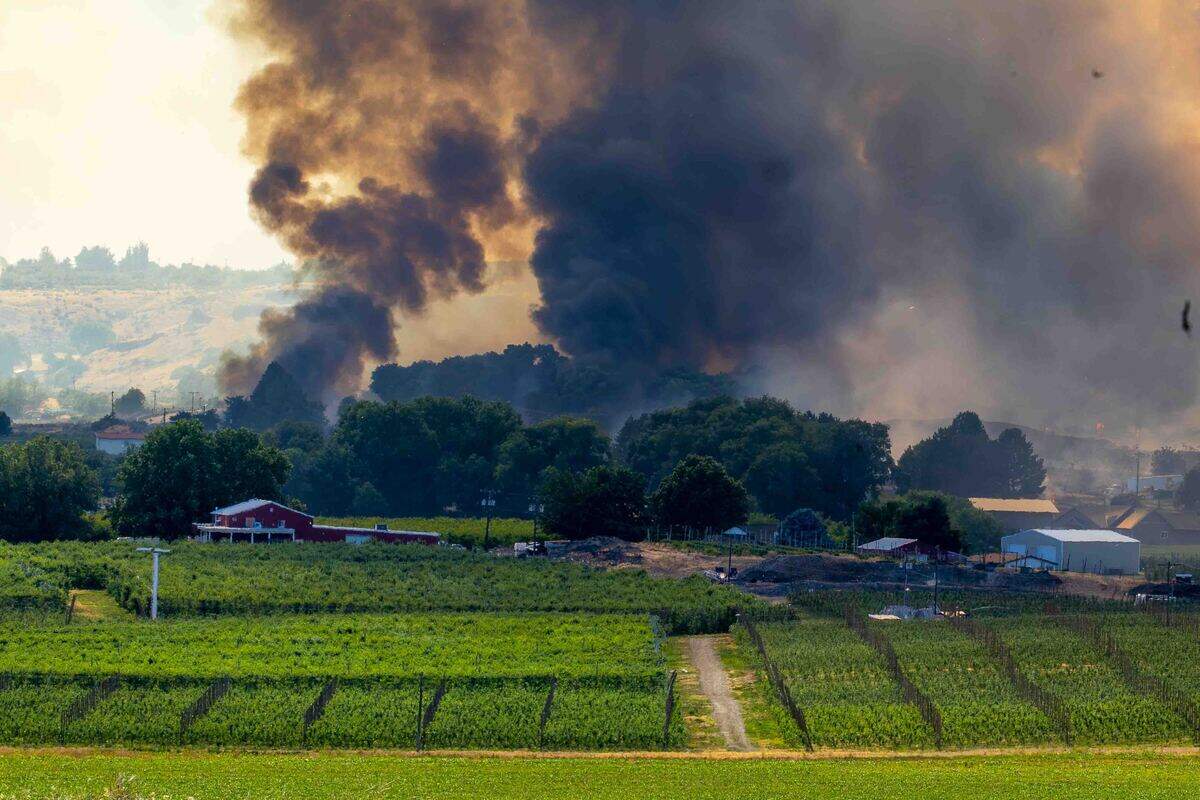 A fire east of Benton City was forcing some residents to be evacuated as it burned near the Old Inland Empire Highway just north of Interstate 82 on Sunday.