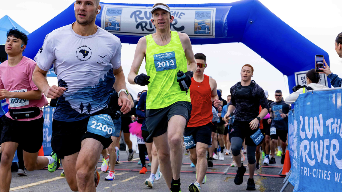 Runners take off from the start line at the Run the River Marathon at 7:30 a.m. Saturday, April 18, 2026, in Columbia Park in Kennewick. The course remained open until 2 p.m. for participants to finish.