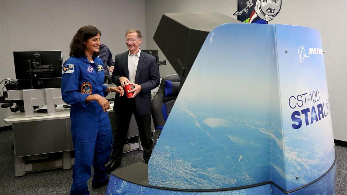 NASA astronaut Suni Williams talks with Chris Ferguson, deputy manager of Boeing’s commercial crew program and director of crew and mission operations, about the CST-100 Starliner training simulators at the Johnson Space Center.