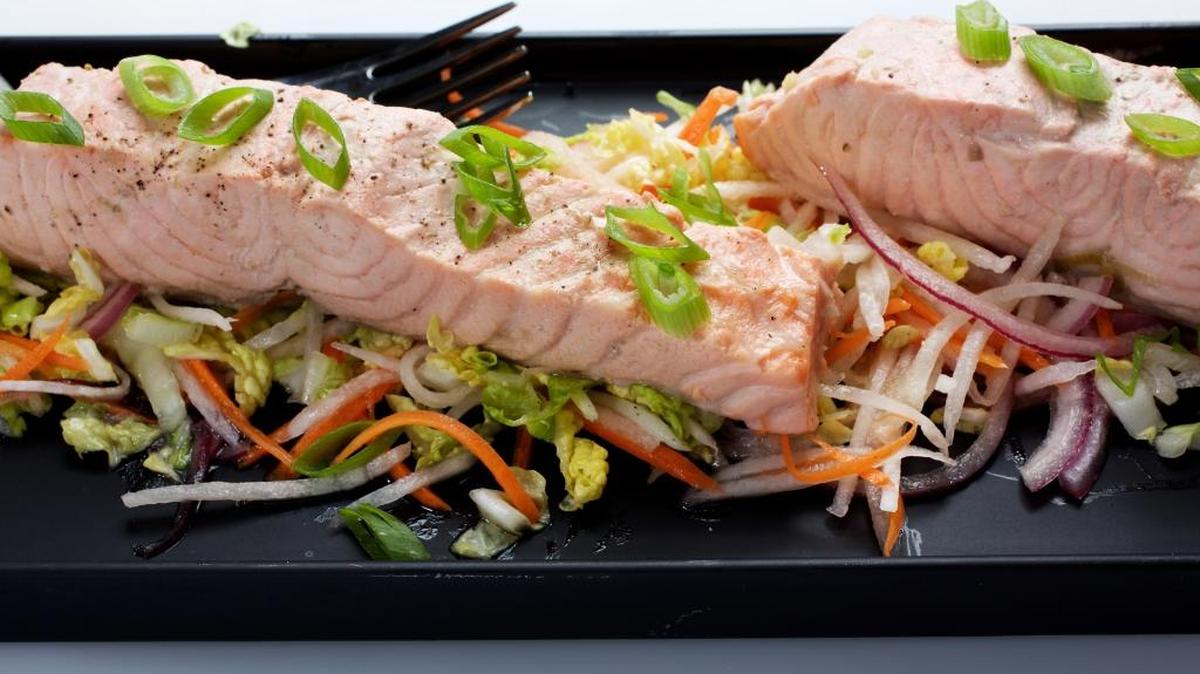 This Green Tea-Poached Salmon emerges not tasting of green tea, per se, but with subtle depth of flavor. The salmon then is placed on a bed of Asian Slaw.