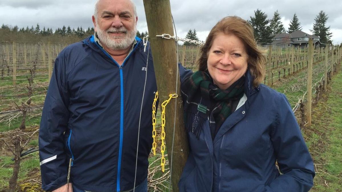 Nick and Sheila Nicholas of Anam Cara Cellars in Newberg, Ore., stand in front of the 6-acre block of vineyards they planted in the Chehalem Mountains American Viticultural Area.