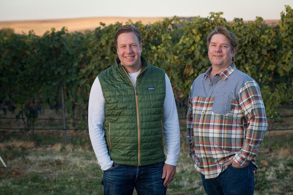 Scott Haladay, left, and his family purchased Walla Walla Vintners in 2017 and talented winemaker William vonMetzger, right, remains in the cellar of the iconic red barn.