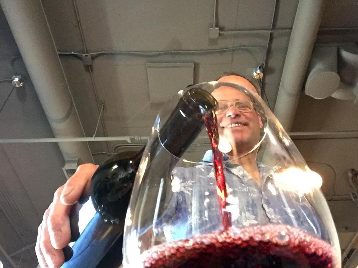 Flint Nelson, winemaker and co-owner at Wit Cellars in Prosser and Woodinville, pours a glass of his cabernet franc. The winery will open in a new tasting room in July 2021.