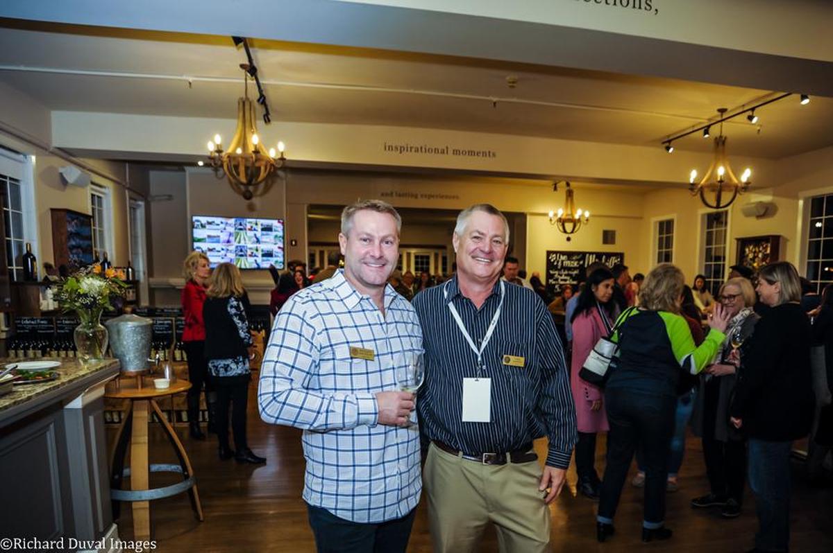 Maryhill Winery winemaker Richard Batchelor, left, and co-owner Craig Leuthold, celebrate the opening of their tasting room at the Hollywood Schoolhouse in Woodinville, Wash. Maryhill Winery Tasting Room & Bistro now operates four tasting rooms across Washington state.
