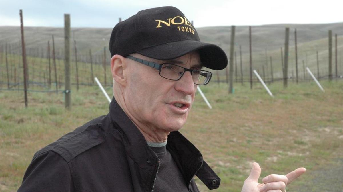 Woodward Canyon owner Rick Small stands in his estate vineyard near his winery at the Walla Walla Valley town of Lowden.