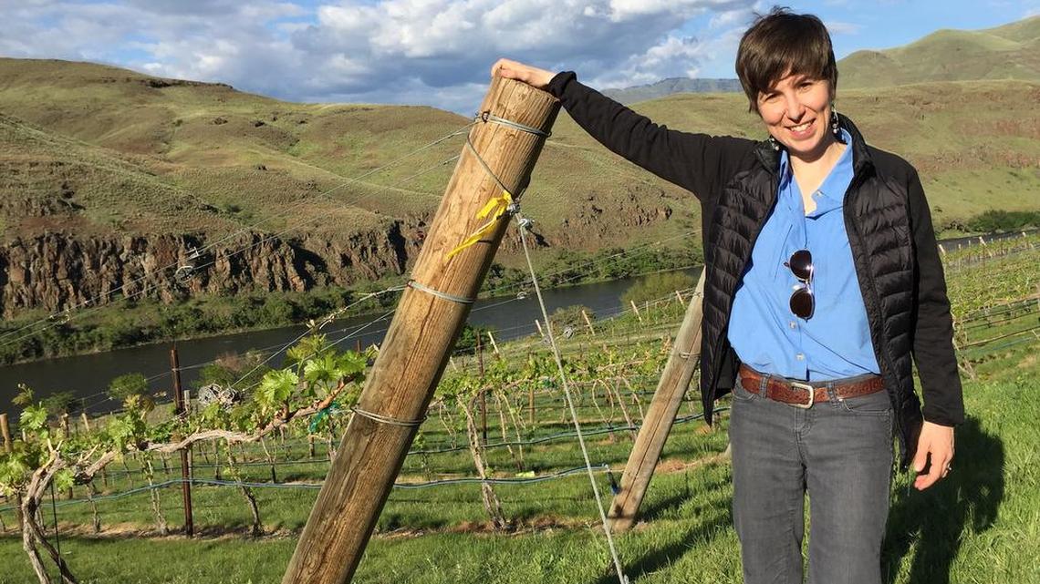 Coco Umiker, winemaker and co-owner of Clearwater Canyon Cellars in Lewiston, Idaho, stands in Rock ‘n J Vineyard near Asotin, Wash. The planting overlooks the Grande Ronde River and is the easternmost vineyard in Washington.