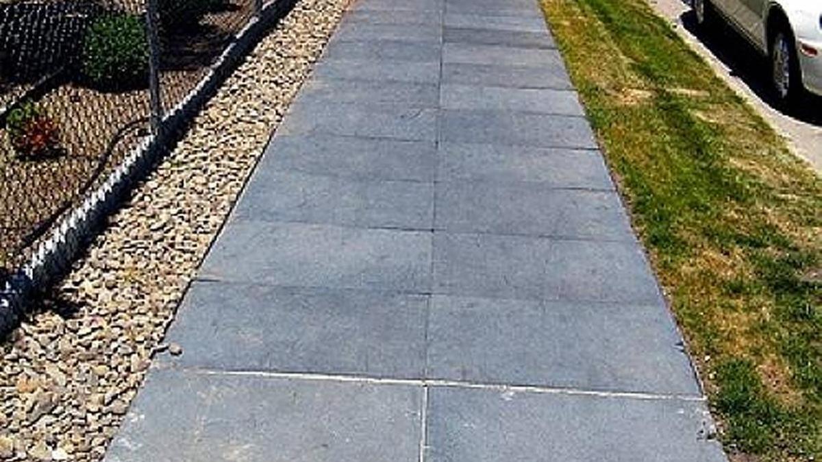 Rubber sidewalks are good for the environment in several ways, not the least of which is their flexibility when tree roots grow near them.