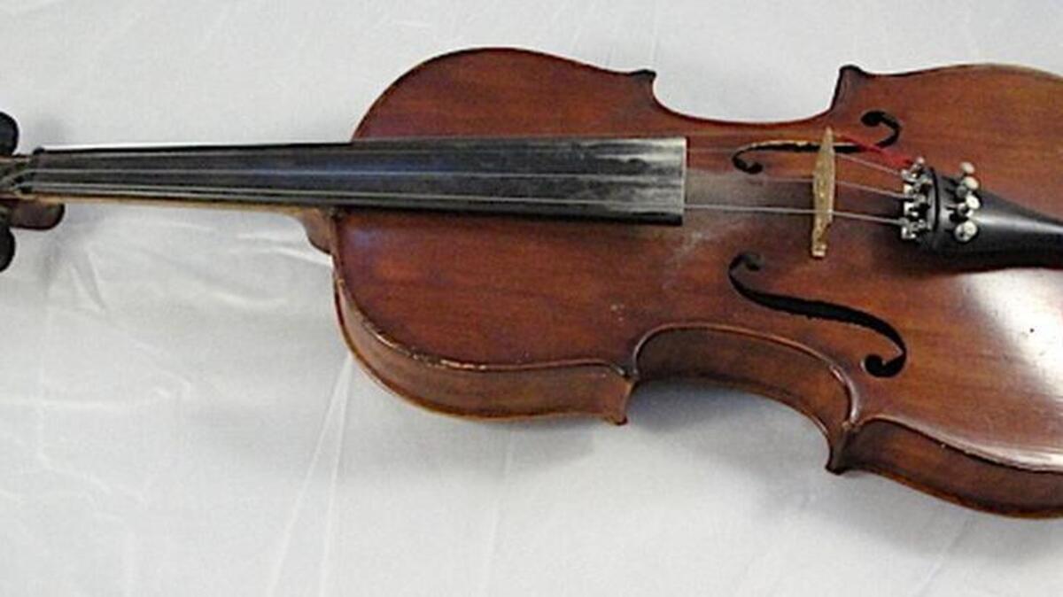 Stradivarius violins are valued in the millions of dollars. Is this the genuine article or one of the hundreds of thousands of reproductions? And, are the case and bow worth much?