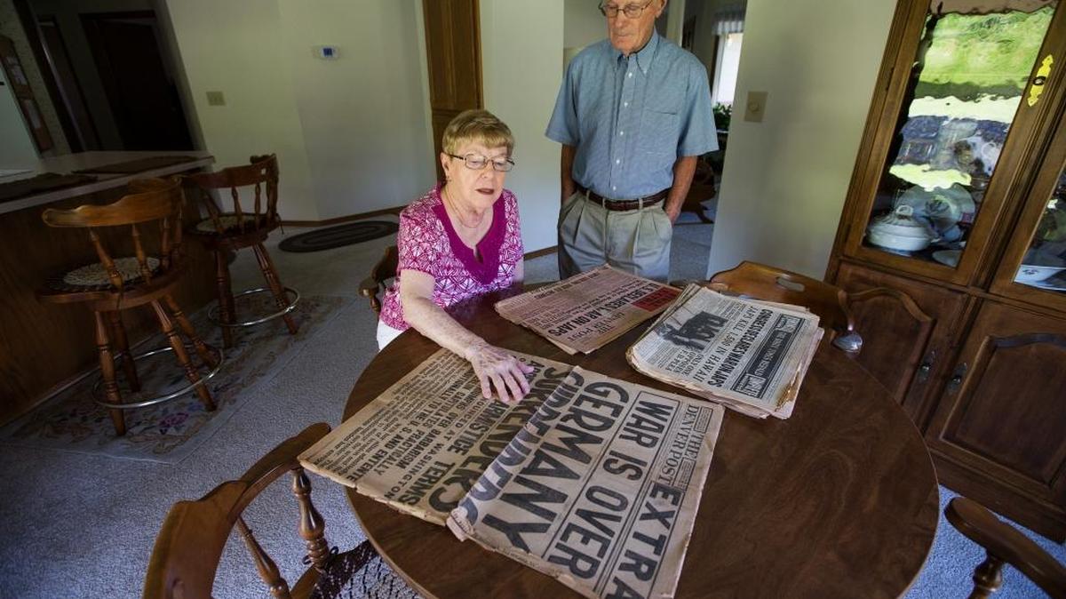 Jim and Chris Leverett look a collection of old newspapers that belonged to Jim’s aunt Mary Cronin at their home in Yakima. The couple found the newspapers while cleaning out a family cabin in Port Ludlow.