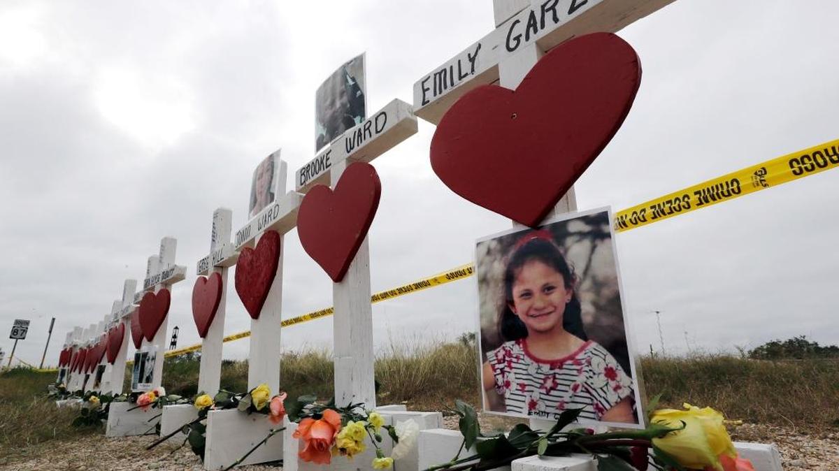 Crosses showing shooting victims names stand near the First Baptist Church in Sutherland Springs, Texas. A man opened fire inside the church in the small South Texas community last Sunday, killing more than two dozen and injuring others.