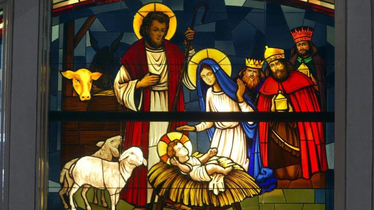 Stained glass depicting the birth of Jesus sits above the main doors at St. Joseph’s Catholic Church in Kennewick.