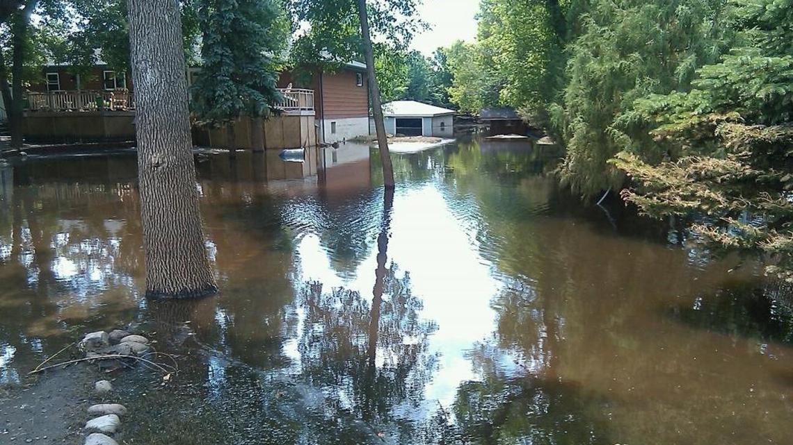 Flood victim holds onto keepsake after loss