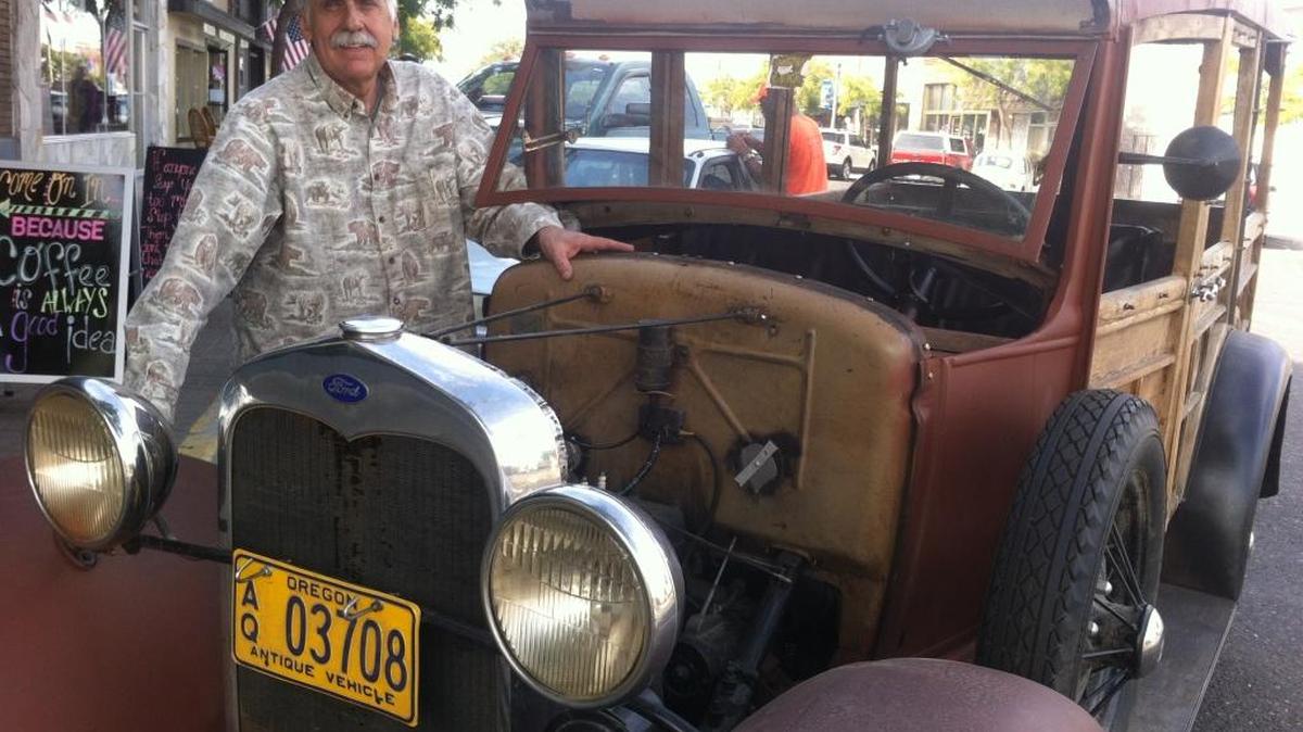 John Trumbo with his unrestored1930 Model A Ford purchased after his retirement from the Tri-City Herald in 2012.
