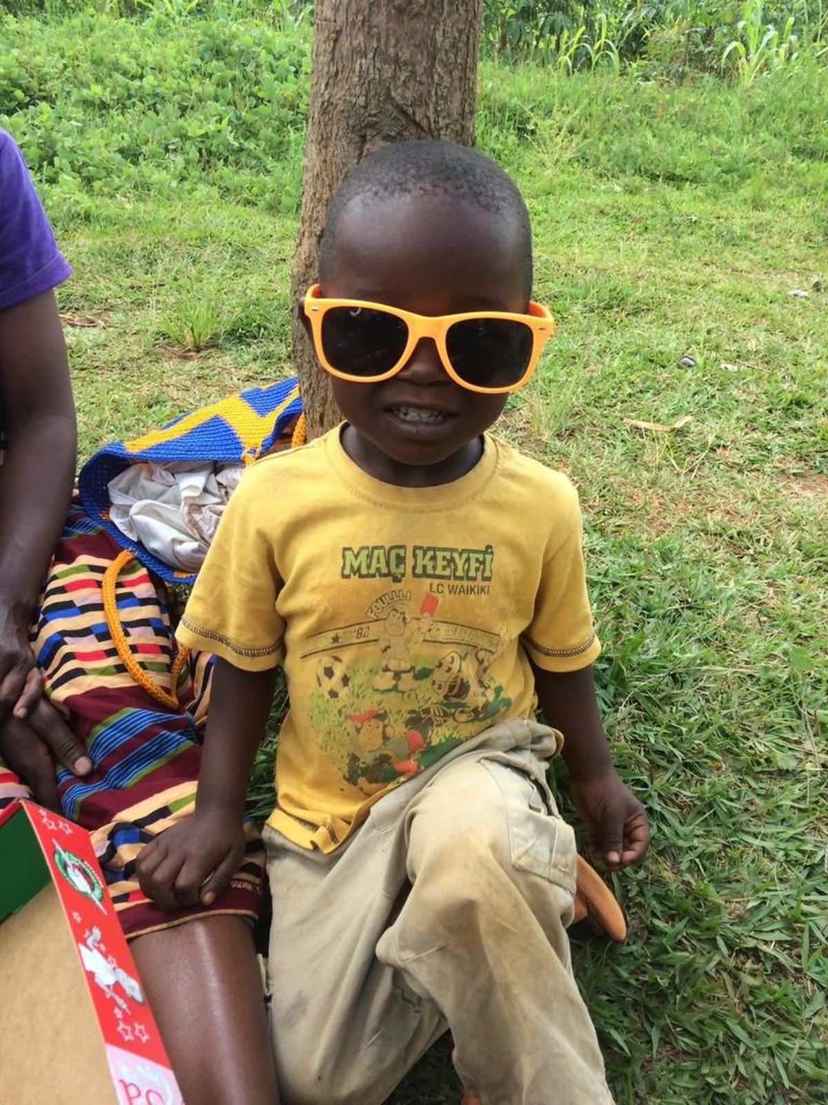 This Rwandan girl found sunglasses in her Operation Christmas Child shoebox, a ministry of Samaritan’s Purse.